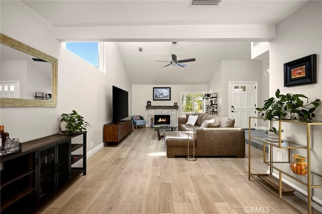 24932 Dove Tree Ln, Lake Forest, CA 92630 - living area featuring a lit fireplace, ceiling fan, light wood finished floors, and high vaulted ceiling