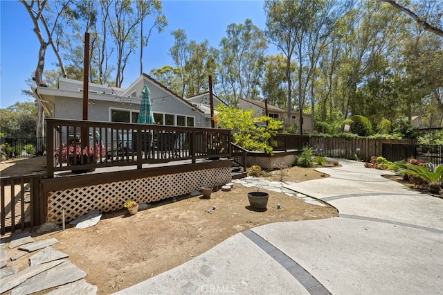 24932 Dove Tree Ln, Lake Forest, CA 92630 - back of house featuring a patio, a wooden deck, and stucco siding