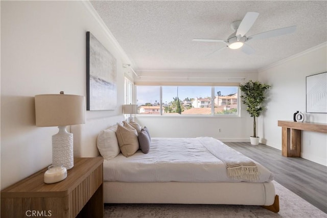 6935 Verde Ridge Rd, Rancho Palos Verdes, CA 90275 - bedroom featuring a textured ceiling, ornamental molding, wood finished floors, and ceiling fan
