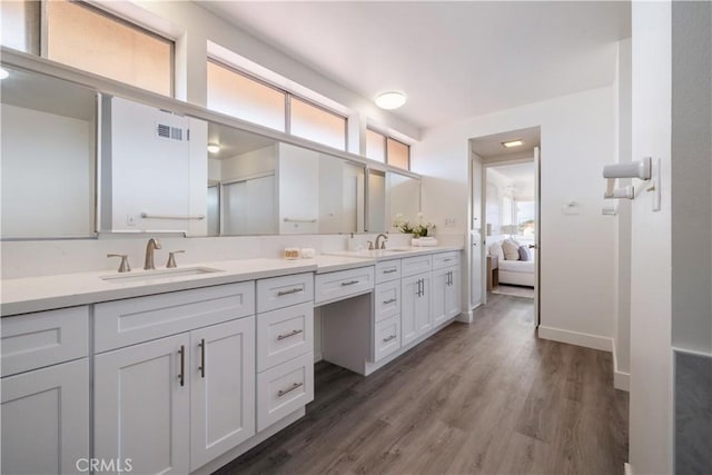 6935 Verde Ridge Rd, Rancho Palos Verdes, CA 90275 - ensuite bathroom featuring double vanity and wood finished floors
