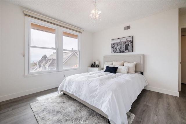 6935 Verde Ridge Rd, Rancho Palos Verdes, CA 90275 - bedroom featuring a chandelier, wood finished floors, and a textured ceiling
