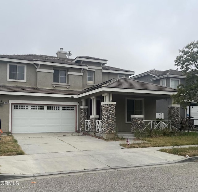 863 Santa Fe St, Fillmore, CA 93015 - prairie-style home featuring a porch, driveway, stucco siding, and a garage