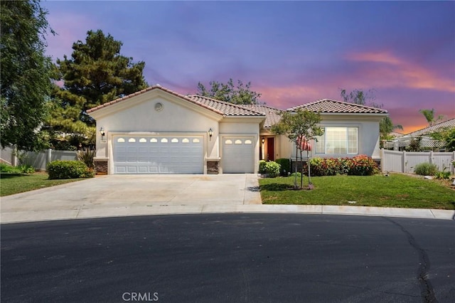1726 Reyes Ln, Beaumont, CA 92223 - mediterranean / spanish-style house featuring stucco siding, driveway, a garage, a tiled roof, and stone siding