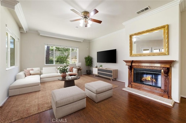 1726 Reyes Ln, Beaumont, CA 92223 - living room with a ceiling fan, wood finished floors, a tiled fireplace, and crown molding