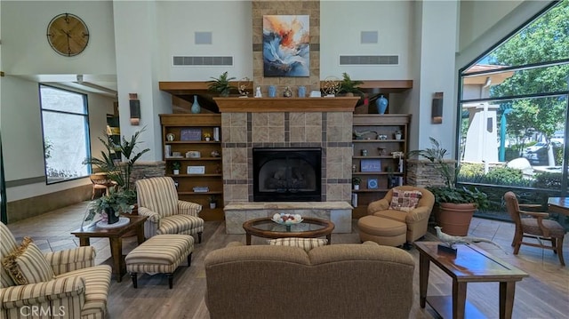 1726 Reyes Ln, Beaumont, CA 92223 - sitting room with a high ceiling, healthy amount of natural light, and a fireplace