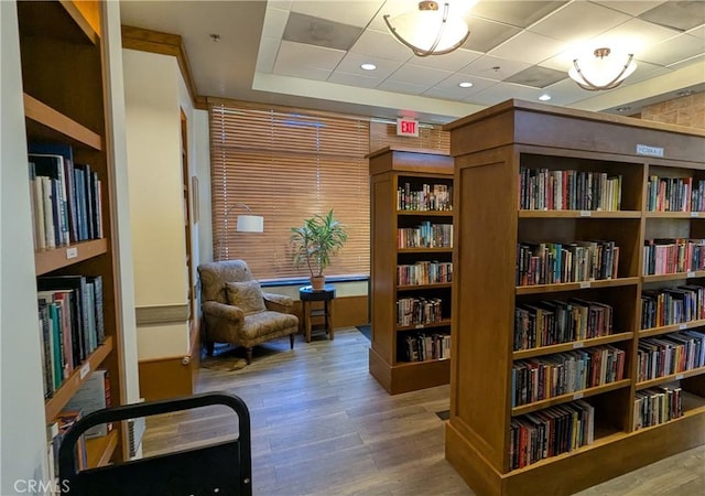 1726 Reyes Ln, Beaumont, CA 92223 - sitting room with wood finished floors and wall of books