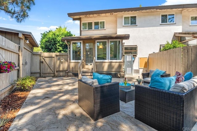 17177 Bernardo Center Dr, San Diego, CA 92128 - rear view of property with an outdoor hangout area, a gate, a fenced backyard, a patio area, and entry steps