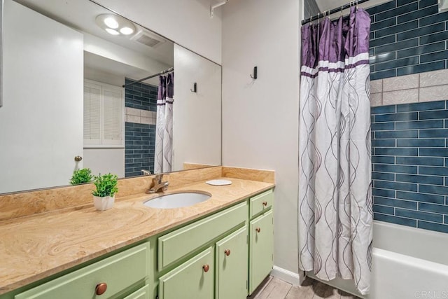 17177 Bernardo Center Dr, San Diego, CA 92128 - bathroom featuring vanity and shower / bathtub combination with curtain