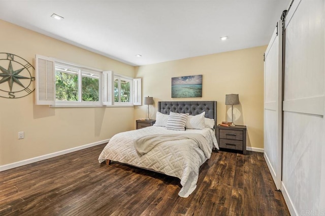 17177 Bernardo Center Dr, San Diego, CA 92128 - bedroom featuring a barn door and wood finished floors