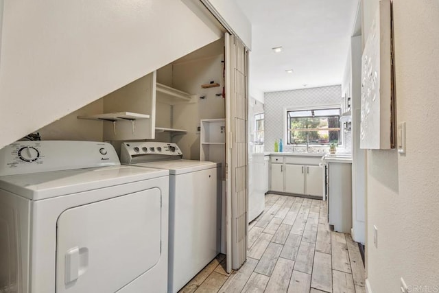 17177 Bernardo Center Dr, San Diego, CA 92128 - laundry room featuring washing machine and clothes dryer and light wood-type flooring