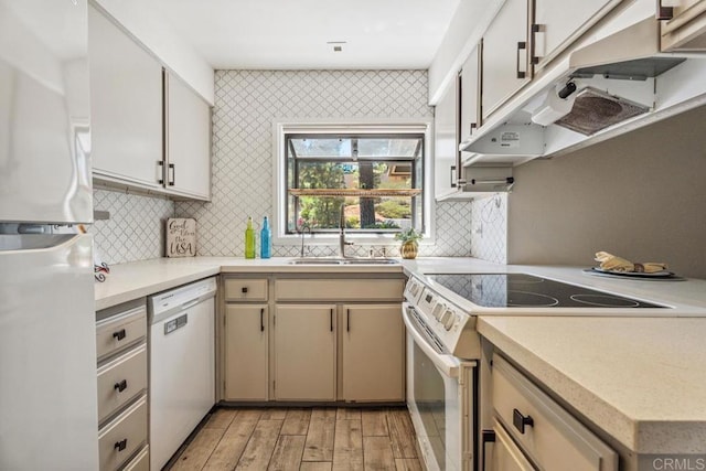 17177 Bernardo Center Dr, San Diego, CA 92128 - kitchen featuring white appliances, light countertops, light wood-style floors, and tasteful backsplash