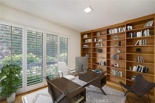 26501 Cortina Dr, Mission Viejo, CA 92691 - office area with a textured ceiling and wood finished floors