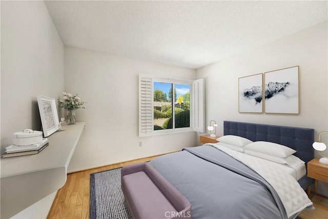 26501 Cortina Dr, Mission Viejo, CA 92691 - bedroom with a textured ceiling and wood finished floors