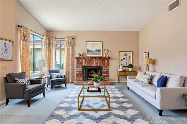 5050 Canyon Crest Dr Unit 5, Riverside, CA 92507 - carpeted living room with a brick fireplace and baseboards