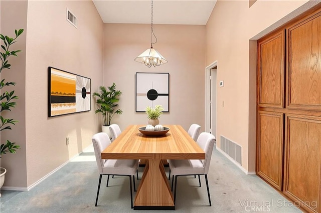 5050 Canyon Crest Dr Unit 5, Riverside, CA 92507 - dining room featuring light carpet and a chandelier
