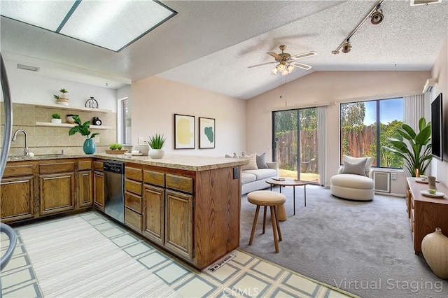 5050 Canyon Crest Dr Unit 5, Riverside, CA 92507 - kitchen with dishwasher, open floor plan, open shelves, a peninsula, and light countertops