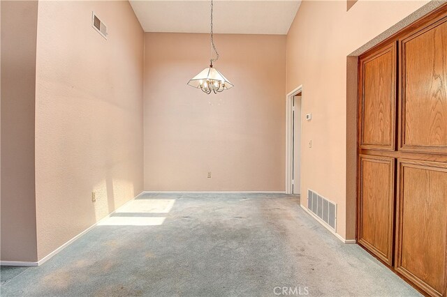 5050 Canyon Crest Dr Unit 5, Riverside, CA 92507 - spare room with light carpet and a chandelier