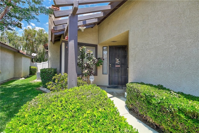 5050 Canyon Crest Dr Unit 5, Riverside, CA 92507 - entrance to property featuring stucco siding and a pergola