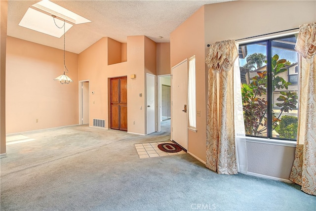 5050 Canyon Crest Dr Unit 5, Riverside, CA 92507 - carpeted spare room with a skylight and high vaulted ceiling