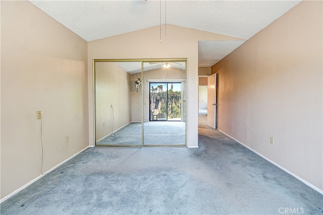 5050 Canyon Crest Dr Unit 5, Riverside, CA 92507 - unfurnished bedroom with vaulted ceiling, carpet flooring, a closet, and access to outside