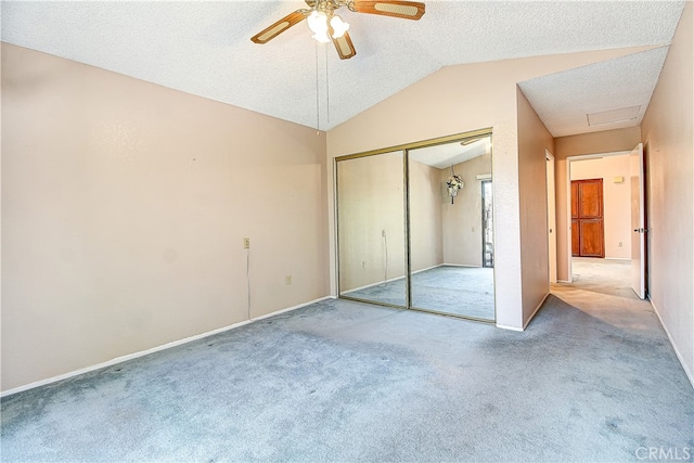 5050 Canyon Crest Dr Unit 5, Riverside, CA 92507 - unfurnished bedroom with lofted ceiling, carpet flooring, a textured ceiling, a closet, and ceiling fan