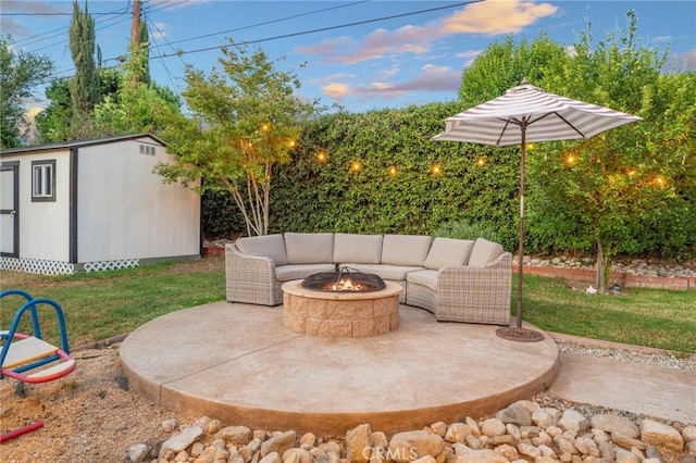 2240 La Sierra Way, Claremont, CA 91711 - patio terrace at dusk with a storage shed, a patio, and an outdoor living space with a fire pit