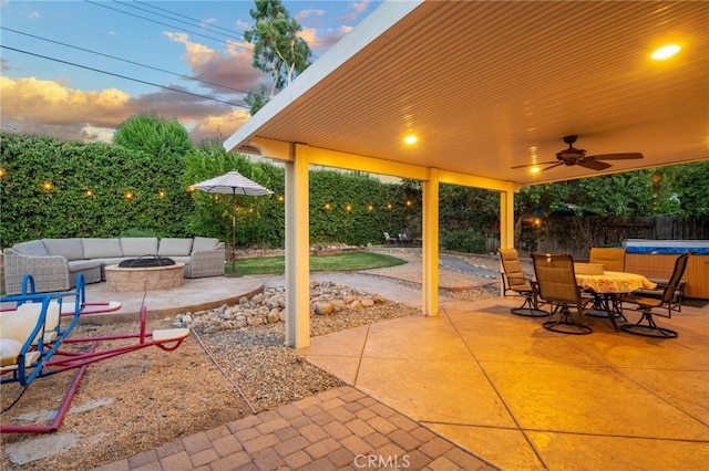 2240 La Sierra Way, Claremont, CA 91711 - fenced backyard with a hot tub, a patio area, an outdoor living space with a fire pit, a ceiling fan, and outdoor dining space