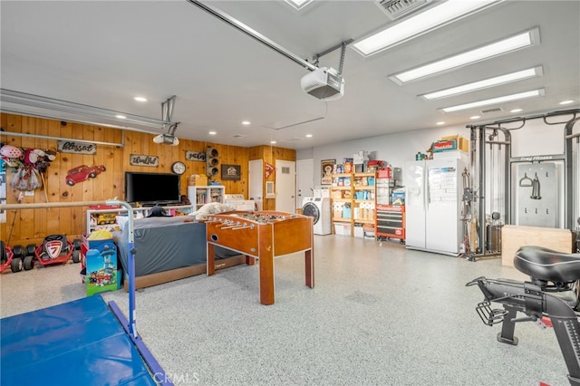 2240 La Sierra Way, Claremont, CA 91711 - recreation room with a garage, washer / dryer, speckled floor, recessed lighting, and wooden walls
