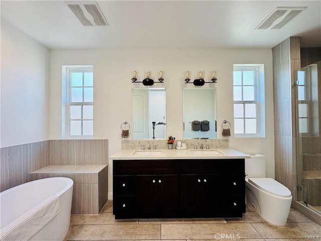 118 N Allen Ave Unit 2, Pasadena, CA 91106 - bathroom with healthy amount of natural light, a freestanding bath, a shower stall, and tile patterned flooring