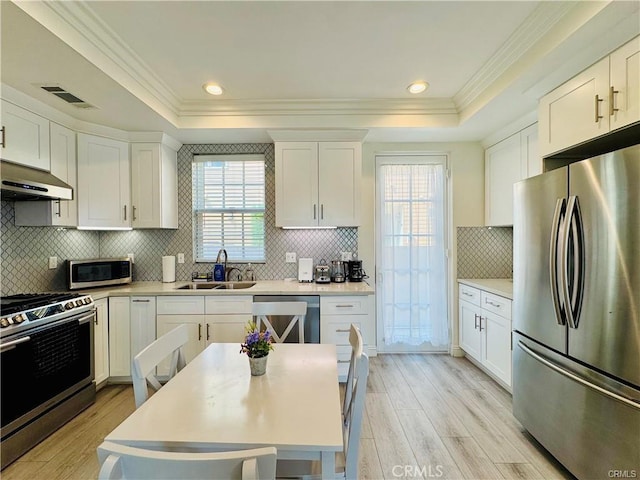 118 N Allen Ave Unit 2, Pasadena, CA 91106 - kitchen featuring stainless steel appliances, a raised ceiling, light wood-style flooring, crown molding, and recessed lighting
