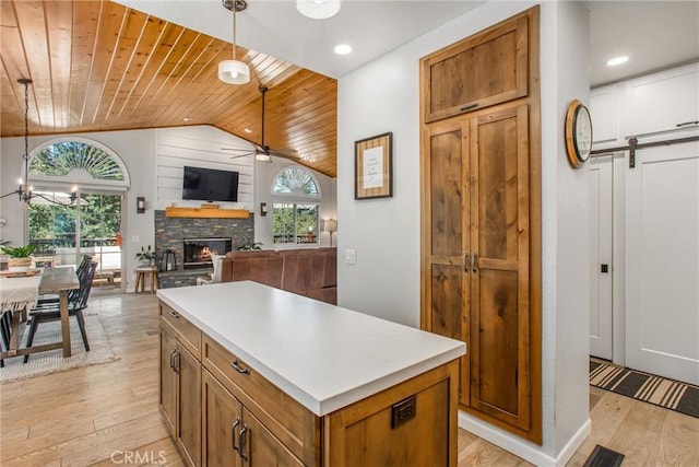 32425 Snowshoe Ln, Running Springs, CA 92382 - kitchen with wood ceiling, vaulted ceiling, a ceiling fan, light wood-style flooring, and a stone fireplace