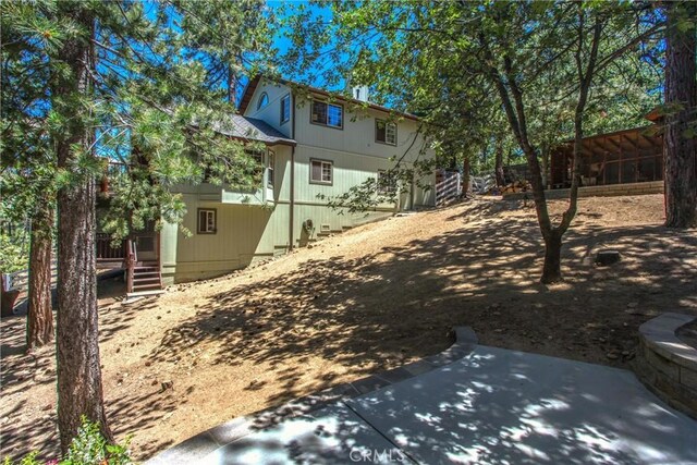 32425 Snowshoe Ln, Running Springs, CA 92382 - view of yard featuring a patio area and a wooden deck