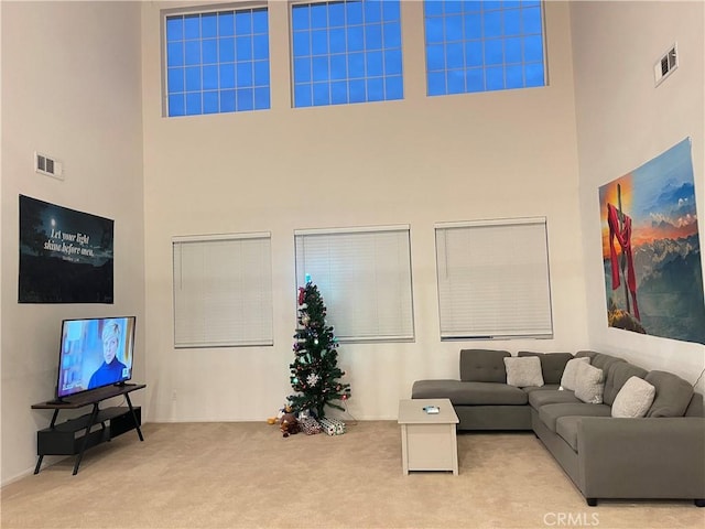 12639 Spruce Hill Rd, Moreno Valley, CA 92555 - carpeted living room featuring a towering ceiling