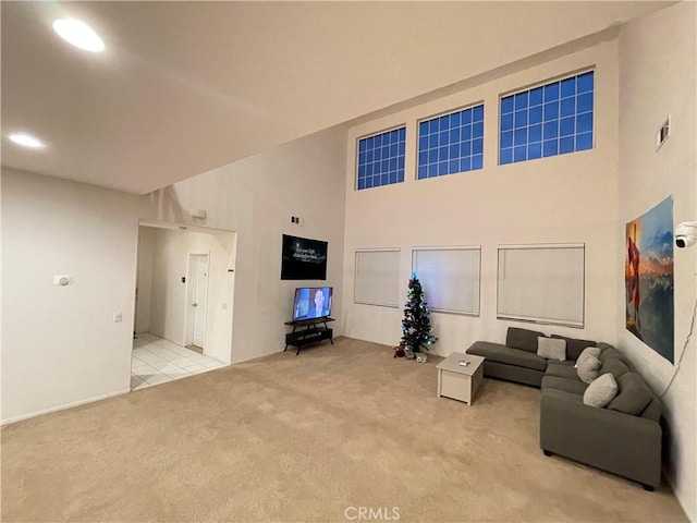 12639 Spruce Hill Rd, Moreno Valley, CA 92555 - carpeted living area with a towering ceiling