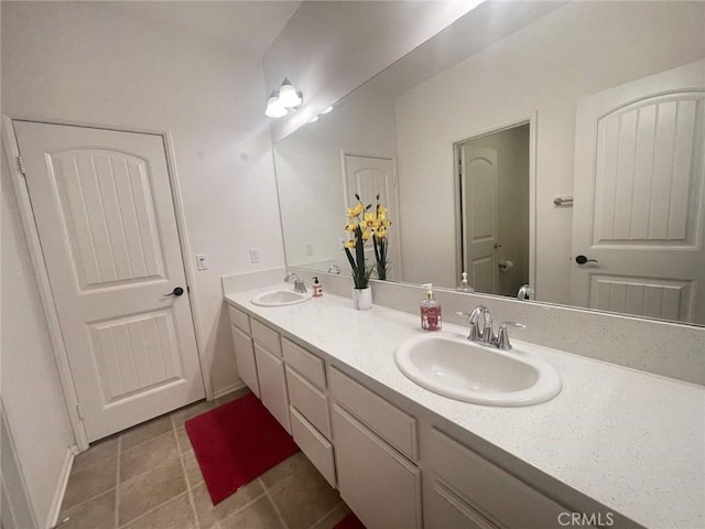 12639 Spruce Hill Rd, Moreno Valley, CA 92555 - bathroom with double vanity and tile patterned floors