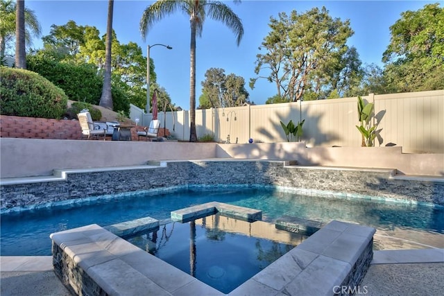 29862 Via Puesta Del Sol, Temecula, CA 92591 - view of swimming pool featuring a fenced backyard and a pool with connected hot tub