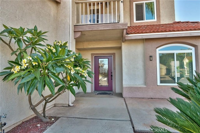 29862 Via Puesta Del Sol, Temecula, CA 92591 - view of exterior entry featuring stucco siding, a balcony, and a tiled roof
