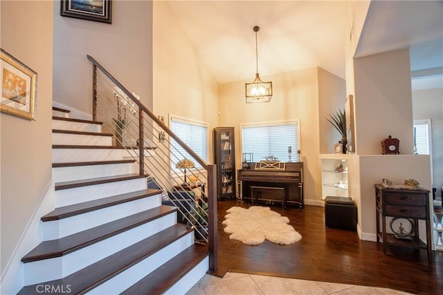 29862 Via Puesta Del Sol, Temecula, CA 92591 - foyer entrance featuring a chandelier, high vaulted ceiling, stairs, and wood finished floors