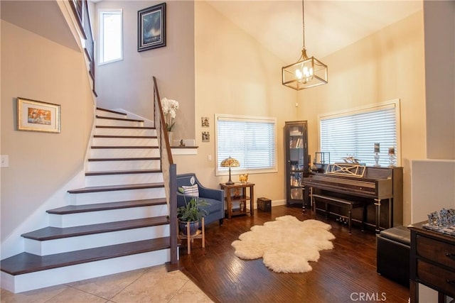 29862 Via Puesta Del Sol, Temecula, CA 92591 - entryway featuring stairway, high vaulted ceiling, a chandelier, plenty of natural light, and wood finished floors