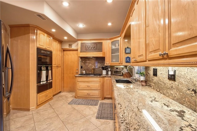 29862 Via Puesta Del Sol, Temecula, CA 92591 - kitchen featuring a warming drawer, light stone counters, tasteful backsplash, refrigerator, and stainless steel gas cooktop