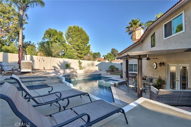 29862 Via Puesta Del Sol, Temecula, CA 92591 - view of swimming pool featuring french doors, a fenced backyard, a pool with connected hot tub, and a patio area