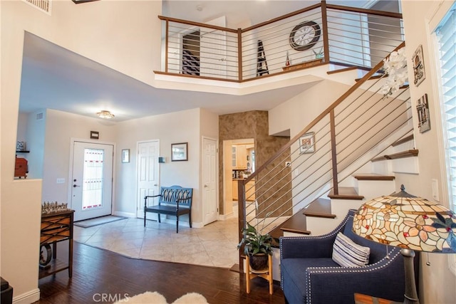 29862 Via Puesta Del Sol, Temecula, CA 92591 - entryway with a high ceiling, stairway, wood finished floors, and healthy amount of natural light