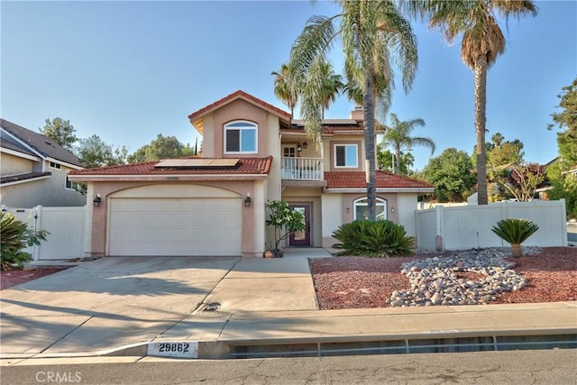 29862 Via Puesta Del Sol, Temecula, CA 92591 - mediterranean / spanish-style home with a tiled roof, solar panels, stucco siding, a gate, and driveway