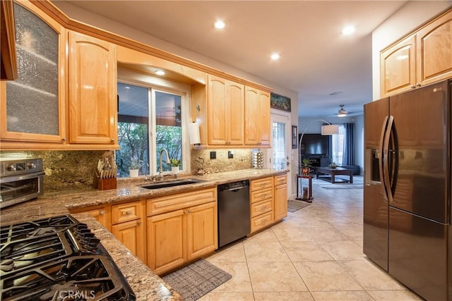 29862 Via Puesta Del Sol, Temecula, CA 92591 - kitchen featuring black appliances, decorative backsplash, light stone countertops, glass insert cabinets, and recessed lighting