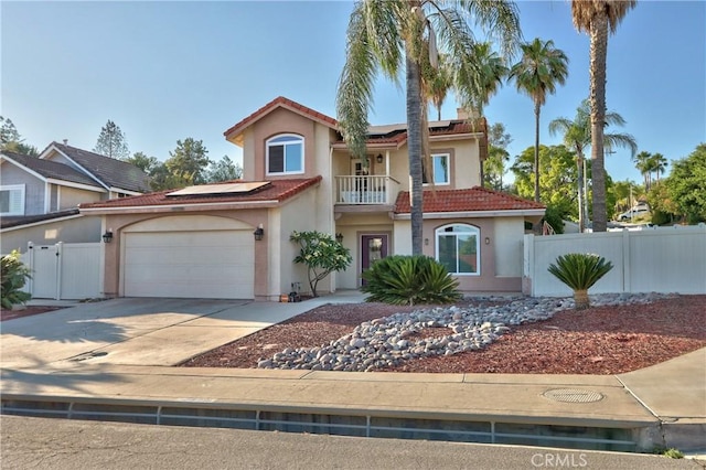 29862 Via Puesta Del Sol, Temecula, CA 92591 - mediterranean / spanish home with a balcony, solar panels, a tiled roof, concrete driveway, and a garage
