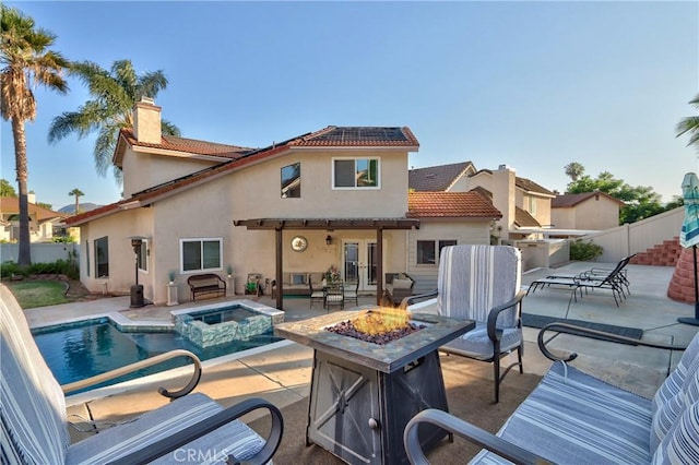 29862 Via Puesta Del Sol, Temecula, CA 92591 - back of house with a fire pit, french doors, a patio area, and a chimney