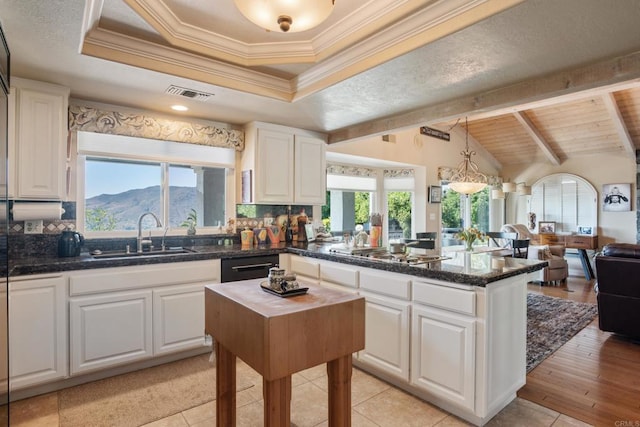 1524 Zutano Ln, Fallbrook, CA 92028 - kitchen featuring stainless steel gas stovetop, open floor plan, a peninsula, white cabinetry, and tasteful backsplash