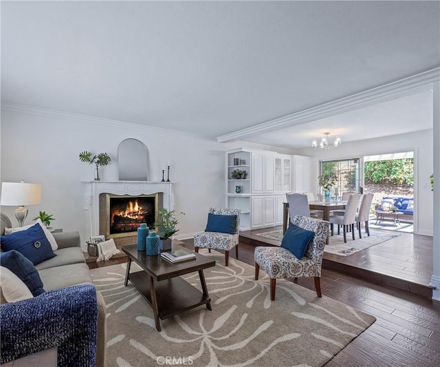 415 Buttonwood Dr, Brea, CA 92821 - living area with ornamental molding, a chandelier, a warm lit fireplace, and wood finished floors