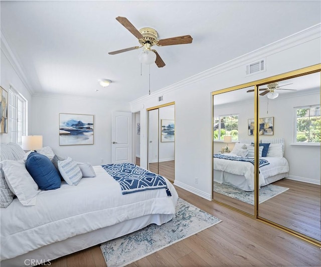 415 Buttonwood Dr, Brea, CA 92821 - bedroom with ornamental molding, wood finished floors, multiple closets, and ceiling fan
