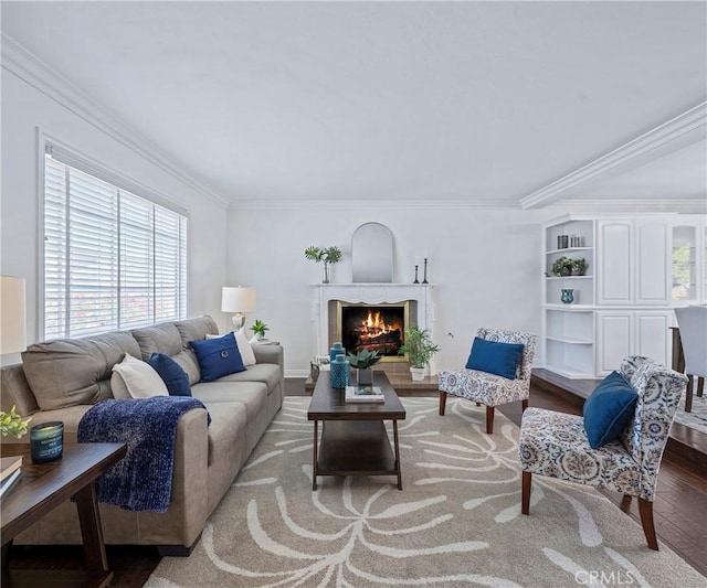 415 Buttonwood Dr, Brea, CA 92821 - living room with wood finished floors, crown molding, and a lit fireplace